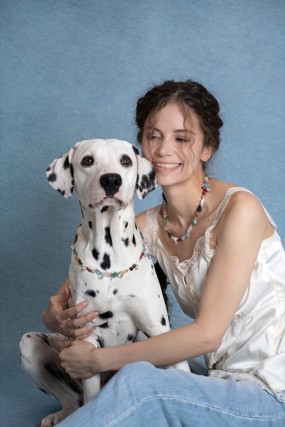 Woman and Dalmatian wearing the Wildflower Charm companion necklace set